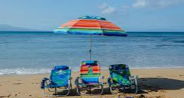 Beach chairs and umbrella set up on the sand at Mission Beach